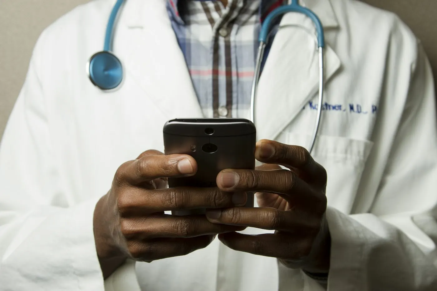 Healthcare professional in a white coat with a stethoscope