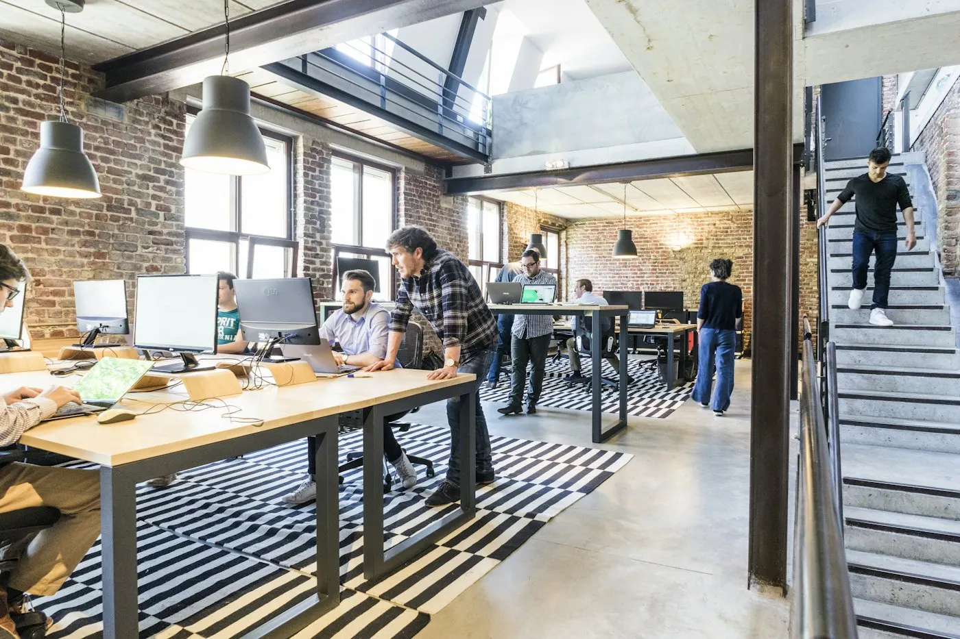 Team working at desks in a bright open-plan office